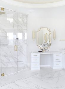 Bathroom mirror and white stone countertop installation in Easton contemporary home remodel