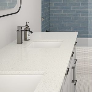 Modern bathroom interior with white quartz countertop and chrome tap